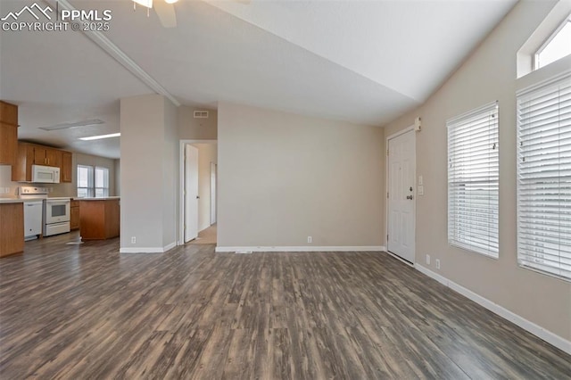 20150 Enoch Rd, Colorado Springs, CO 80930 - unfurnished living room featuring vaulted ceiling, dark wood-style flooring, healthy amount of natural light, a ceiling fan, and baseboards