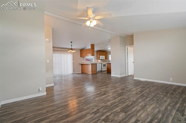 20150 Enoch Rd, Colorado Springs, CO 80930 - unfurnished living room with lofted ceiling, dark wood-type flooring, baseboards, a chandelier, and ornamental molding