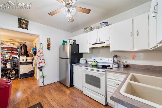 1416 S Wahsatch Ave, Colorado Springs, CO 80905 - kitchen featuring white appliances, under cabinet range hood, a sink, white cabinetry, and a ceiling fan