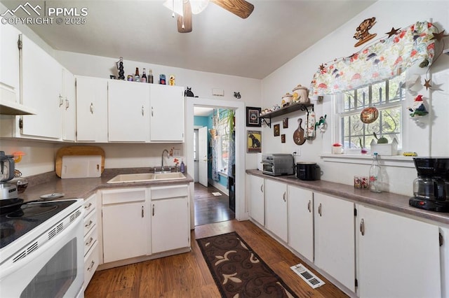 1416 S Wahsatch Ave, Colorado Springs, CO 80905 - kitchen featuring a sink, white electric range oven, wood finished floors, ceiling fan, and white cabinetry