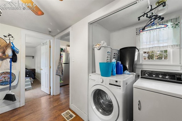 1416 S Wahsatch Ave, Colorado Springs, CO 80905 - laundry room with washer and dryer and wood finished floors