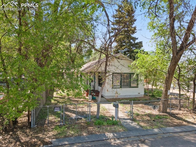 1416 S Wahsatch Ave, Colorado Springs, CO 80905 - obstructed view of property featuring crawl space, a fenced front yard, and a gate