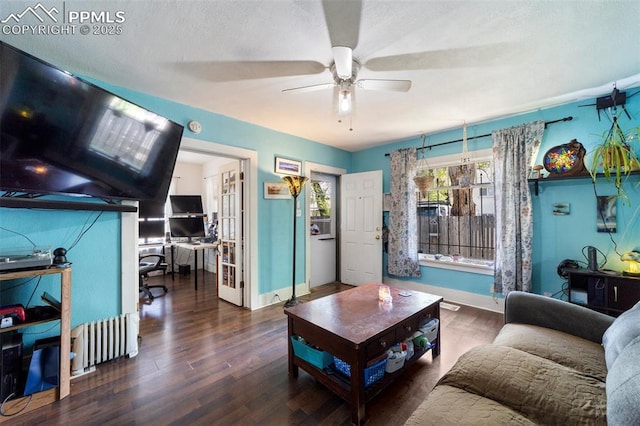 1416 S Wahsatch Ave, Colorado Springs, CO 80905 - living area featuring an office area, radiator heating unit, wood finished floors, a ceiling fan, and baseboards