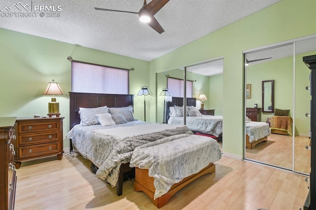 1018 Fontmore Rd Unit D, Colorado Springs, CO 80904 - bedroom featuring wood finished floors, a textured ceiling, ceiling fan, and two closets