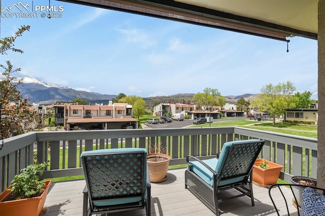 1018 Fontmore Rd Unit D, Colorado Springs, CO 80904 - deck featuring a mountain view and a residential view