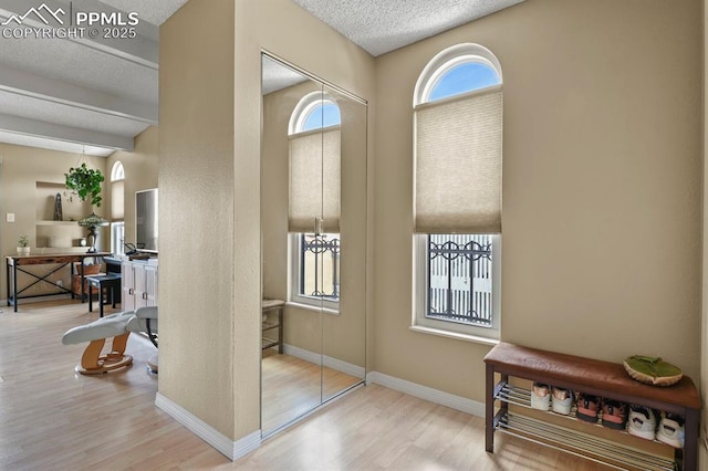1018 Fontmore Rd Unit D, Colorado Springs, CO 80904 - entrance foyer featuring wood finished floors, a textured ceiling, and baseboards