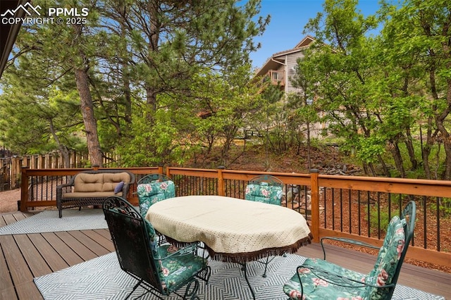 720 Popes Valley Dr, Colorado Springs, CO 80919 - deck with outdoor dining space and an outdoor living space