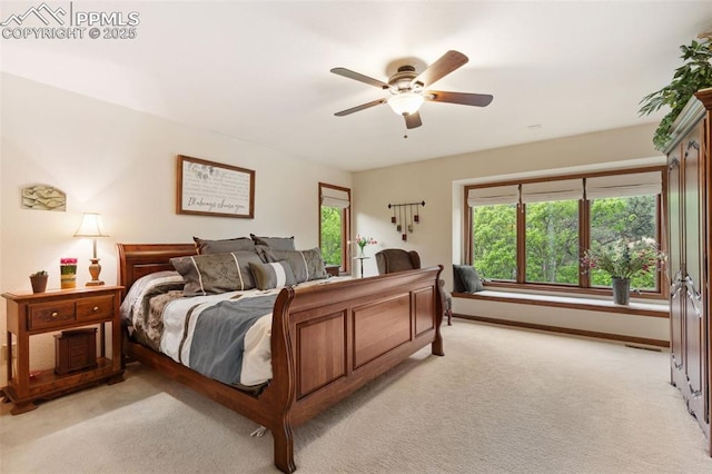 720 Popes Valley Dr, Colorado Springs, CO 80919 - bedroom featuring light colored carpet, multiple windows, and ceiling fan