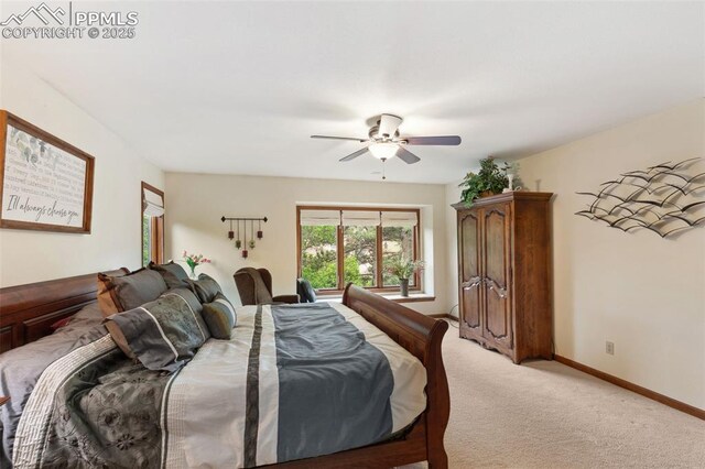 720 Popes Valley Dr, Colorado Springs, CO 80919 - bedroom with light carpet, a ceiling fan, and baseboards