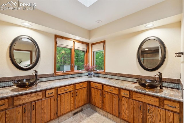 720 Popes Valley Dr, Colorado Springs, CO 80919 - full bath with double vanity and recessed lighting
