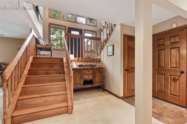 720 Popes Valley Dr, Colorado Springs, CO 80919 - carpeted entryway featuring stairs and baseboards