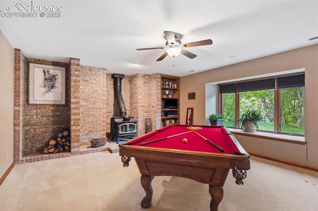 720 Popes Valley Dr, Colorado Springs, CO 80919 - rec room with carpet floors, baseboards, a wood stove, a ceiling fan, and pool table