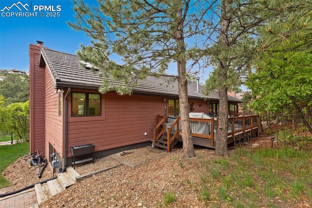 720 Popes Valley Dr, Colorado Springs, CO 80919 - rear view of house featuring a deck and a chimney
