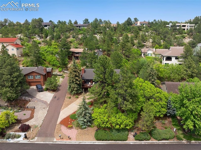 720 Popes Valley Dr, Colorado Springs, CO 80919 - aerial perspective of suburban area featuring a tree filled landscape