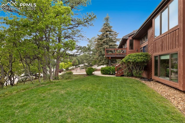 720 Popes Valley Dr, Colorado Springs, CO 80919 - view of green lawn with stairway and a deck