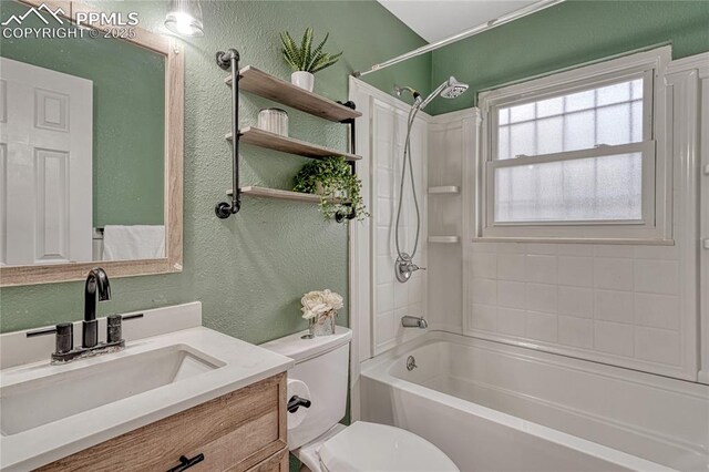 7108 Chippewa Rd, Colorado Springs, CO 80915 - full bathroom featuring a textured wall, vanity, and washtub / shower combination