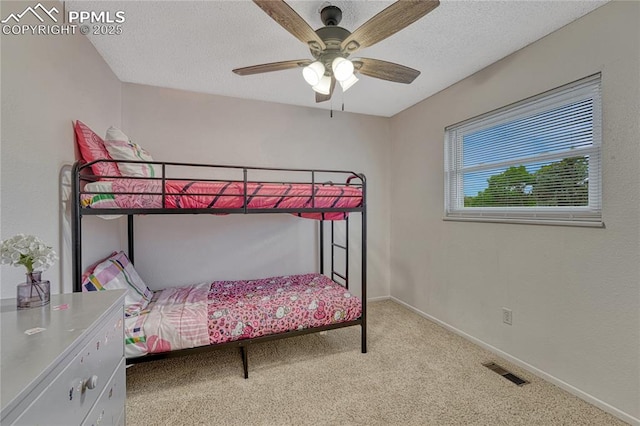 7108 Chippewa Rd, Colorado Springs, CO 80915 - bedroom featuring carpet flooring, a textured ceiling, and a ceiling fan