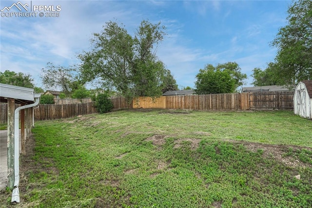 7108 Chippewa Rd, Colorado Springs, CO 80915 - fenced backyard featuring a storage unit
