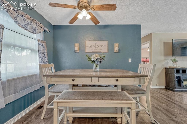 7108 Chippewa Rd, Colorado Springs, CO 80915 - dining space with a textured ceiling, ceiling fan, and wood finished floors