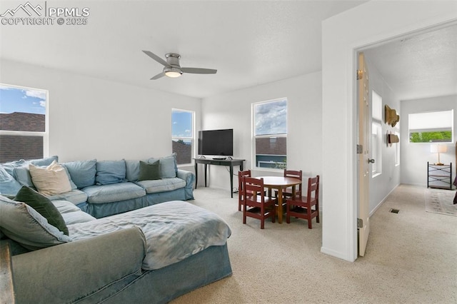 7711 Menagerie Ln, Colorado Springs, CO 80923 - living room featuring light colored carpet and a ceiling fan