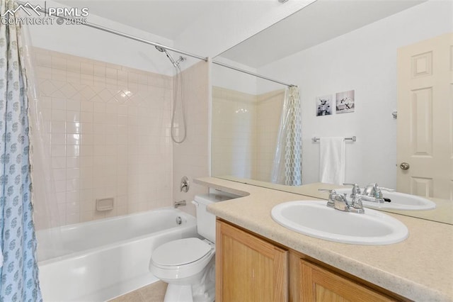 7711 Menagerie Ln, Colorado Springs, CO 80923 - bathroom featuring shower / bath combo with shower curtain, vanity, toilet, and tile patterned floors