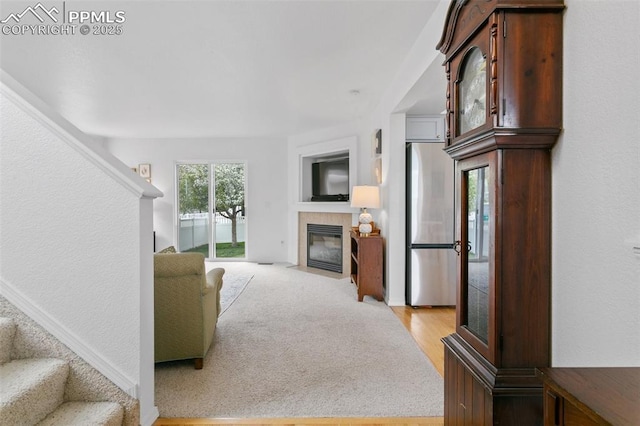 7711 Menagerie Ln, Colorado Springs, CO 80923 - living area with a tiled fireplace and stairway