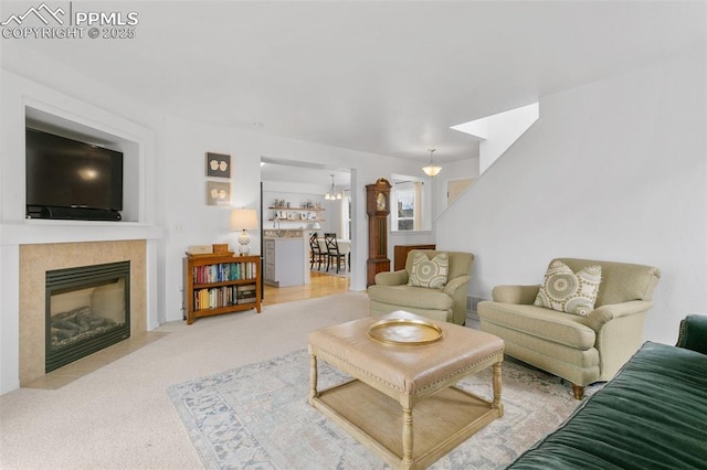 7711 Menagerie Ln, Colorado Springs, CO 80923 - living area featuring carpet flooring and a tiled fireplace