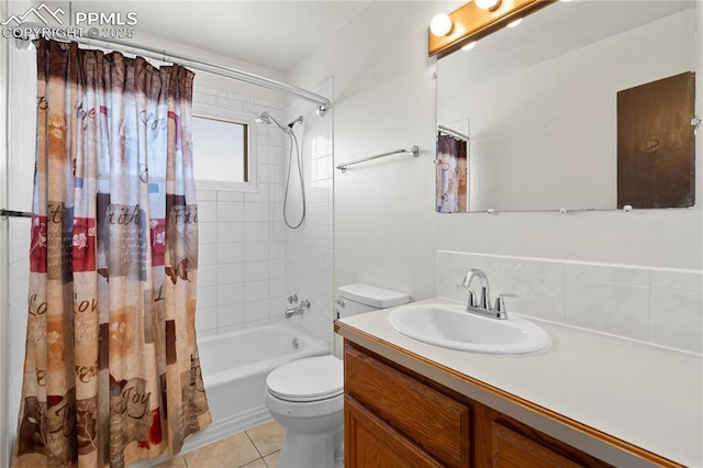 3510 Jon St, Colorado Springs, CO 80907 - bathroom with toilet, vanity, shower / tub combo with curtain, tile patterned floors, and backsplash