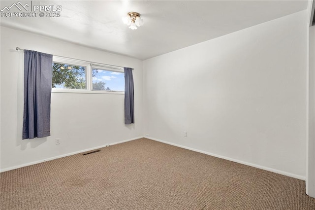 3510 Jon St, Colorado Springs, CO 80907 - carpeted spare room with baseboards