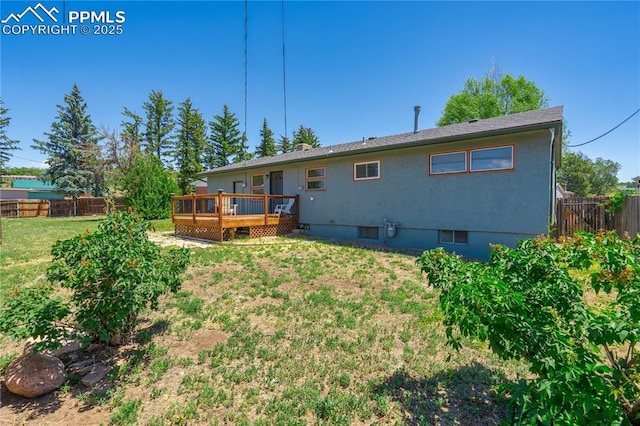 3510 Jon St, Colorado Springs, CO 80907 - rear view of property featuring a wooden deck and stucco siding