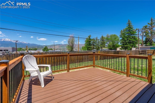 3510 Jon St, Colorado Springs, CO 80907 - wooden deck with a mountain view and a fenced backyard