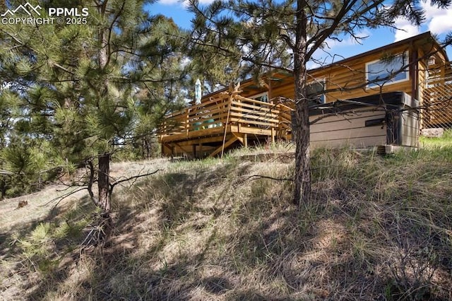 258 Shavano Creek Trl, Florissant, CO 80816 - back of house with a wooden deck