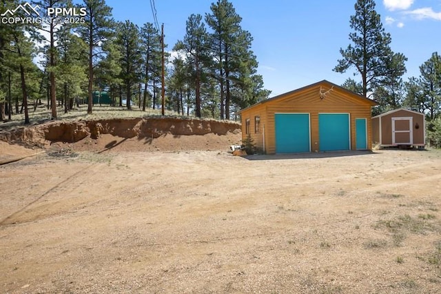 258 Shavano Creek Trl, Florissant, CO 80816 - view of yard featuring a garage