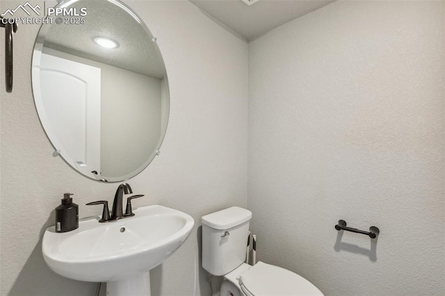 10671 Larimar Pt, Colorado Springs, CO 80905 - half bathroom featuring toilet and a sink