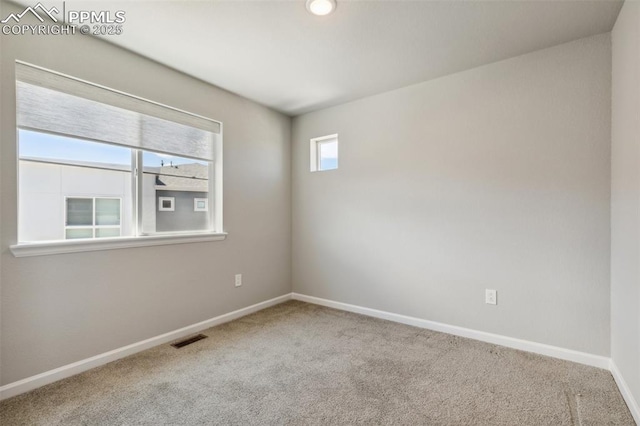10671 Larimar Pt, Colorado Springs, CO 80905 - carpeted empty room featuring baseboards