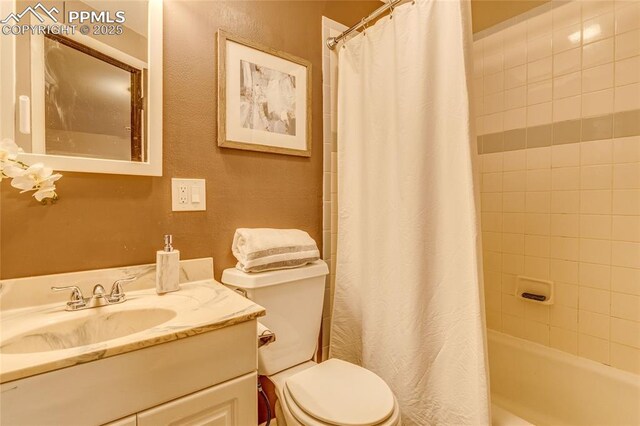 14915 Gleneagle Dr, Colorado Springs, CO 80921 - full bath featuring vanity, toilet, shower / tub combo, and a textured wall