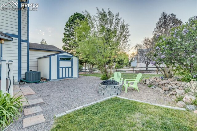 14915 Gleneagle Dr, Colorado Springs, CO 80921 - view of yard featuring an outdoor fire pit, a patio area, and cooling unit