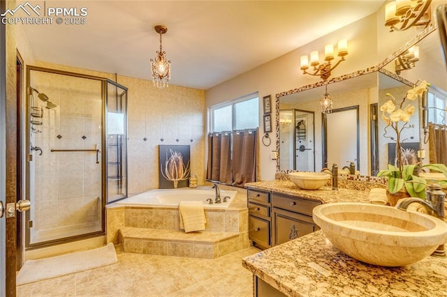 14915 Gleneagle Dr, Colorado Springs, CO 80921 - bathroom featuring vanity, a bath, a stall shower, and a chandelier