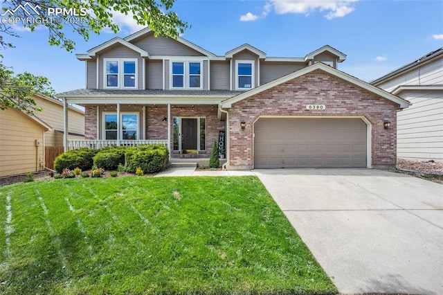 6390 Moccasin Pass Ct, Colorado Springs, CO 80919 - traditional-style house with a porch, a garage, concrete driveway, a front yard, and brick siding