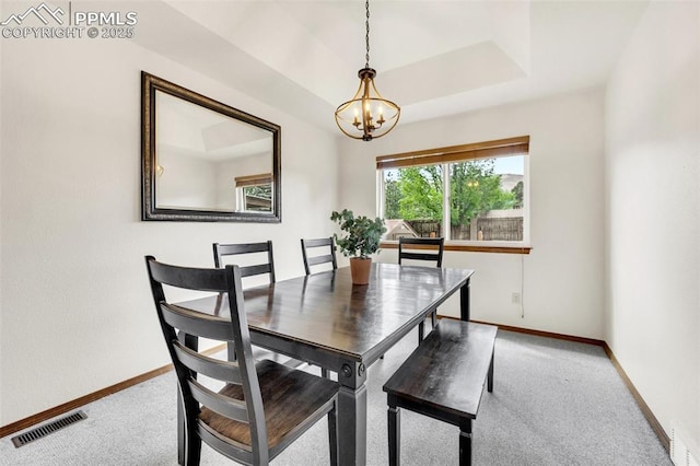 6390 Moccasin Pass Ct, Colorado Springs, CO 80919 - dining area with a chandelier, baseboards, and carpet floors