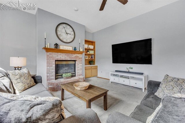 6390 Moccasin Pass Ct, Colorado Springs, CO 80919 - living area featuring carpet floors, ceiling fan, lofted ceiling, a fireplace, and baseboards