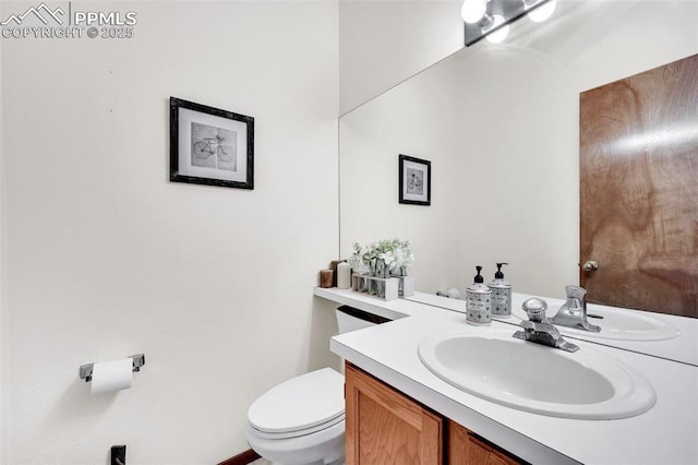 6390 Moccasin Pass Ct, Colorado Springs, CO 80919 - half bathroom featuring vanity and toilet