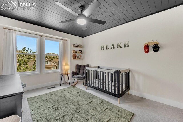 6390 Moccasin Pass Ct, Colorado Springs, CO 80919 - bedroom featuring carpet, baseboards, a nursery area, and ceiling fan