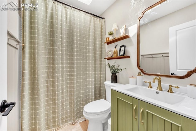 6390 Moccasin Pass Ct, Colorado Springs, CO 80919 - full bathroom with toilet, vanity, and a shower with shower curtain