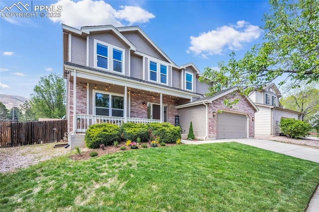 6390 Moccasin Pass Ct, Colorado Springs, CO 80919 - traditional-style house featuring a porch, brick siding, driveway, and a garage