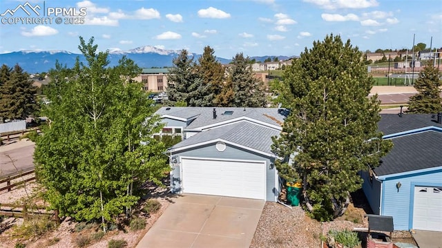 4686 Gray Fox Hts, Colorado Springs, CO 80922 - aerial view of residential area featuring a mountainous background