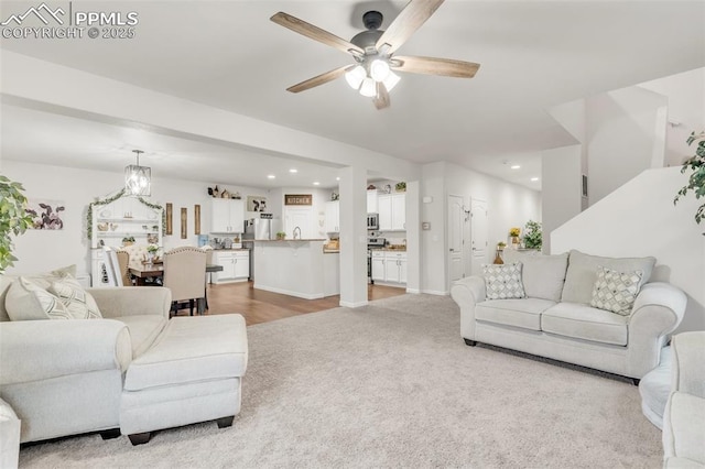 10140 Seawolf Dr, Colorado Springs, CO 80925 - living room featuring a ceiling fan, recessed lighting, and light carpet