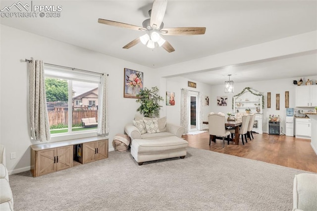 10140 Seawolf Dr, Colorado Springs, CO 80925 - carpeted living area featuring baseboards and a ceiling fan