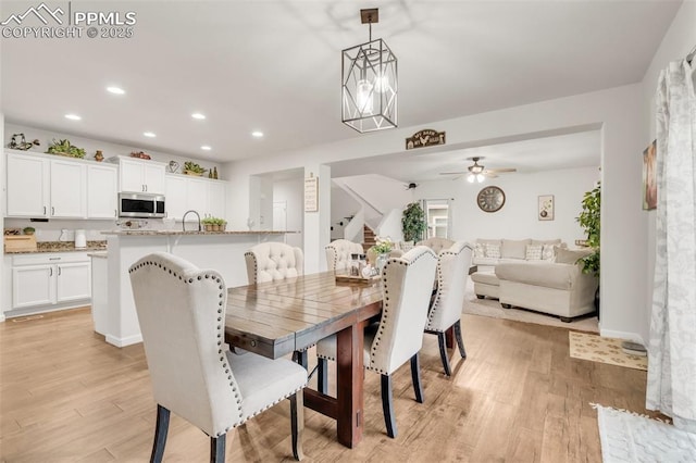 10140 Seawolf Dr, Colorado Springs, CO 80925 - dining area featuring light wood finished floors, recessed lighting, stairs, a ceiling fan, and baseboards