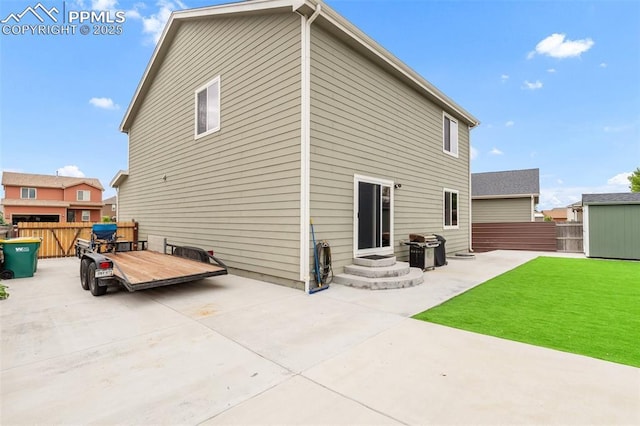 10140 Seawolf Dr, Colorado Springs, CO 80925 - rear view of house with a patio area